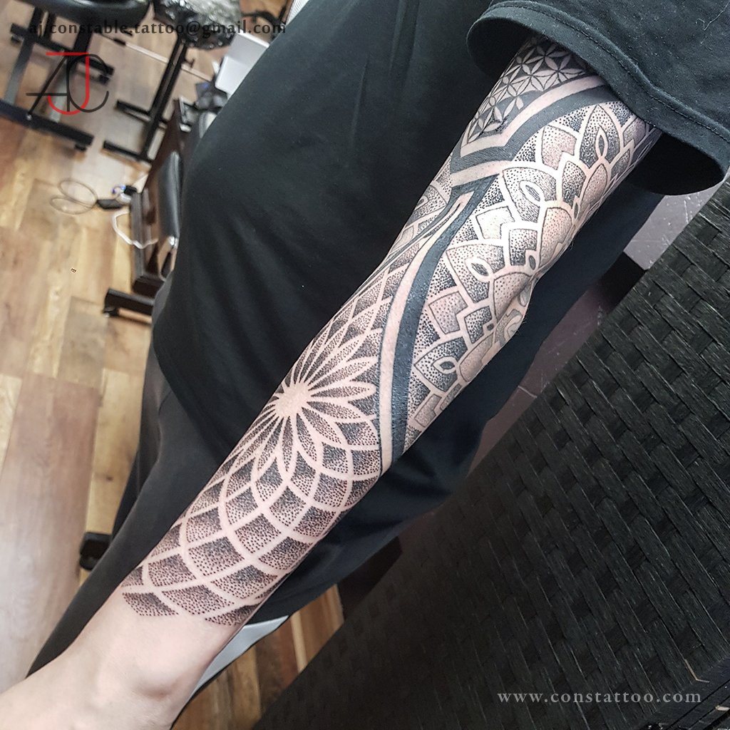 Black and grey geometric sleeve tattoo by AJ Constable tattoo artist