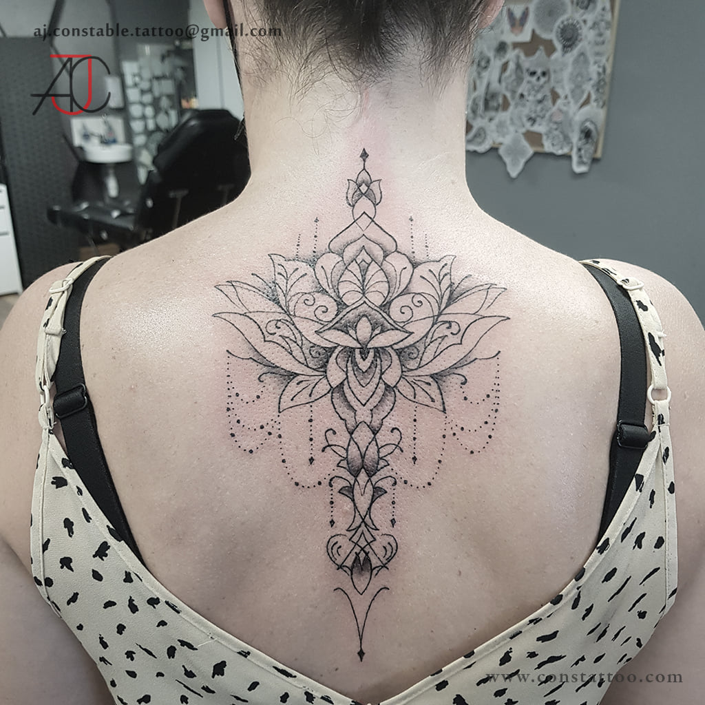 Black and grey fine-line lotus mandala back tattoo by AJ Constable tattoo artist