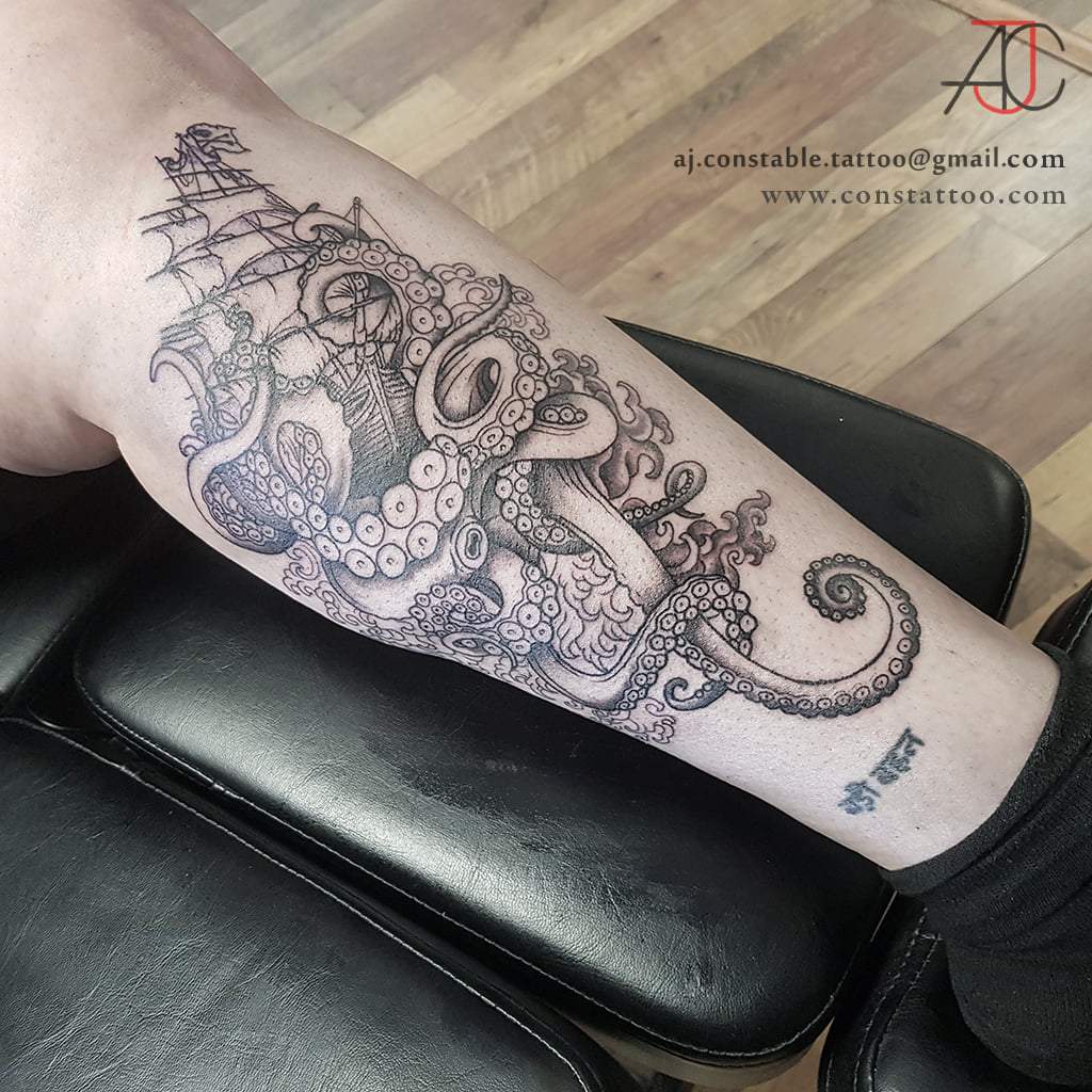 Black and grey ship and kraken tattoo by AJ Constable tattoo artist