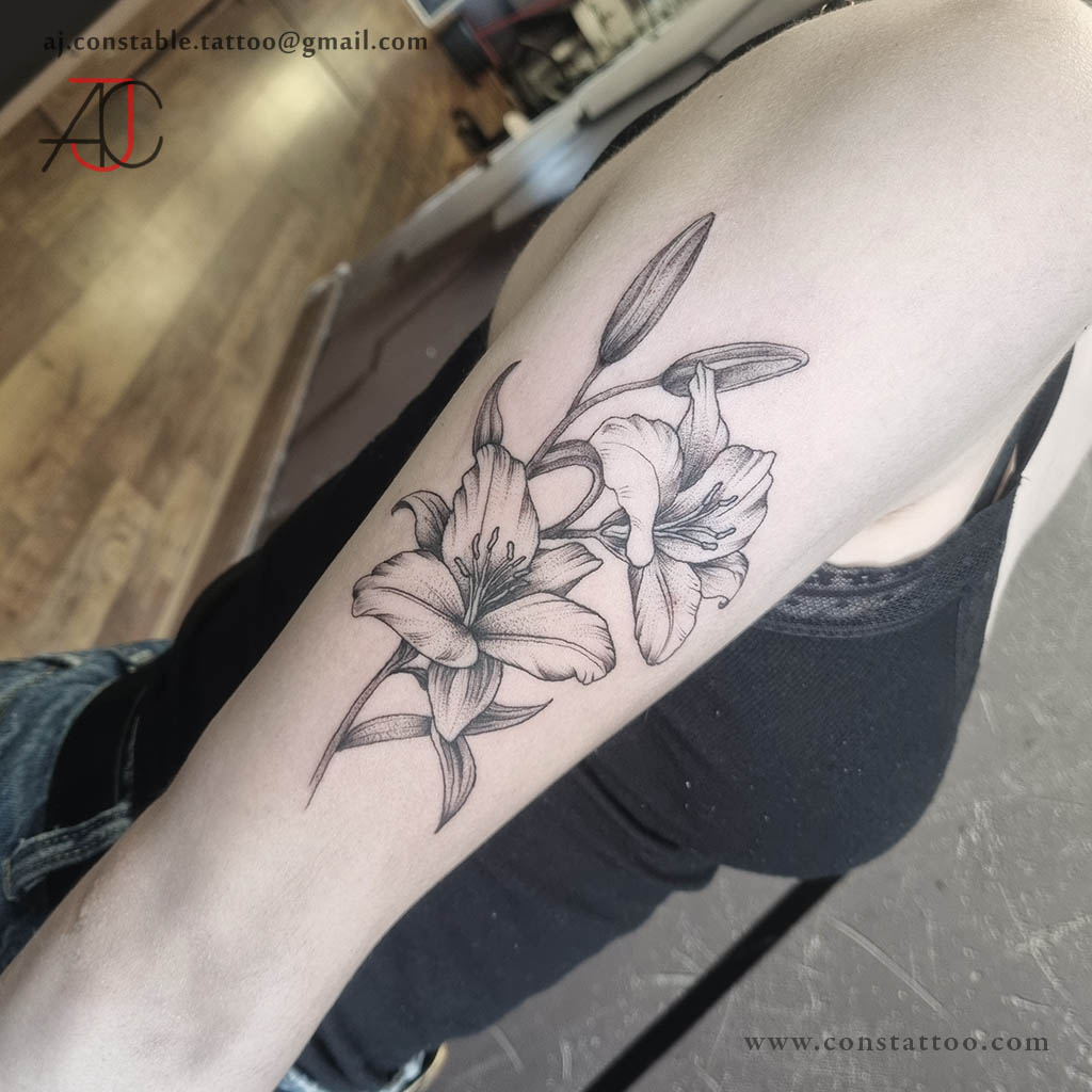 Black and grey lilies tattoo by AJ Constable Tattoo Artist